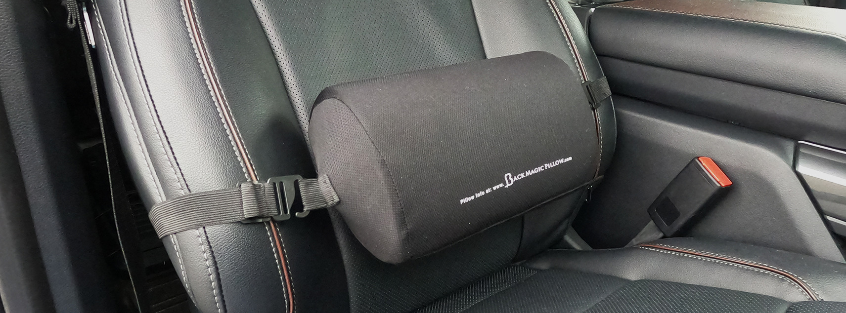 Back Magic Pillow strapped into a car seat